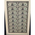 Series 1985 uncut sheet of 16 $1 bills with consecutive serials in wood framed display