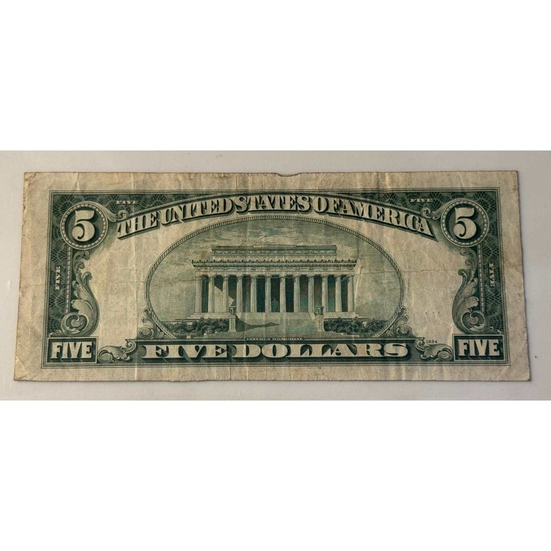 1934 C 5 dollar silver certificate with blue seal featuring Abraham Lincoln vintage US currency