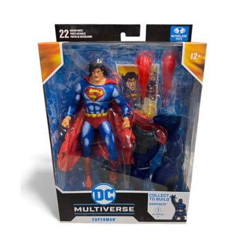 McFarlane DC Multiverse Superman Justice League Task Force action figure in sealed packaging with accessories and trading card