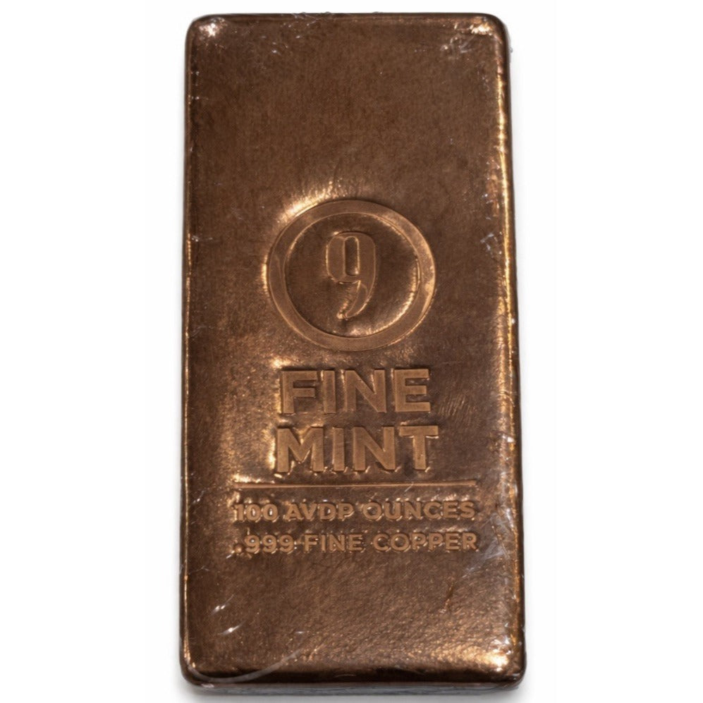 100 oz Copper Bar 9Fine Mint .999 fine copper bullion with poured texture and mint hallmark in original wrapping weighing 7 lb