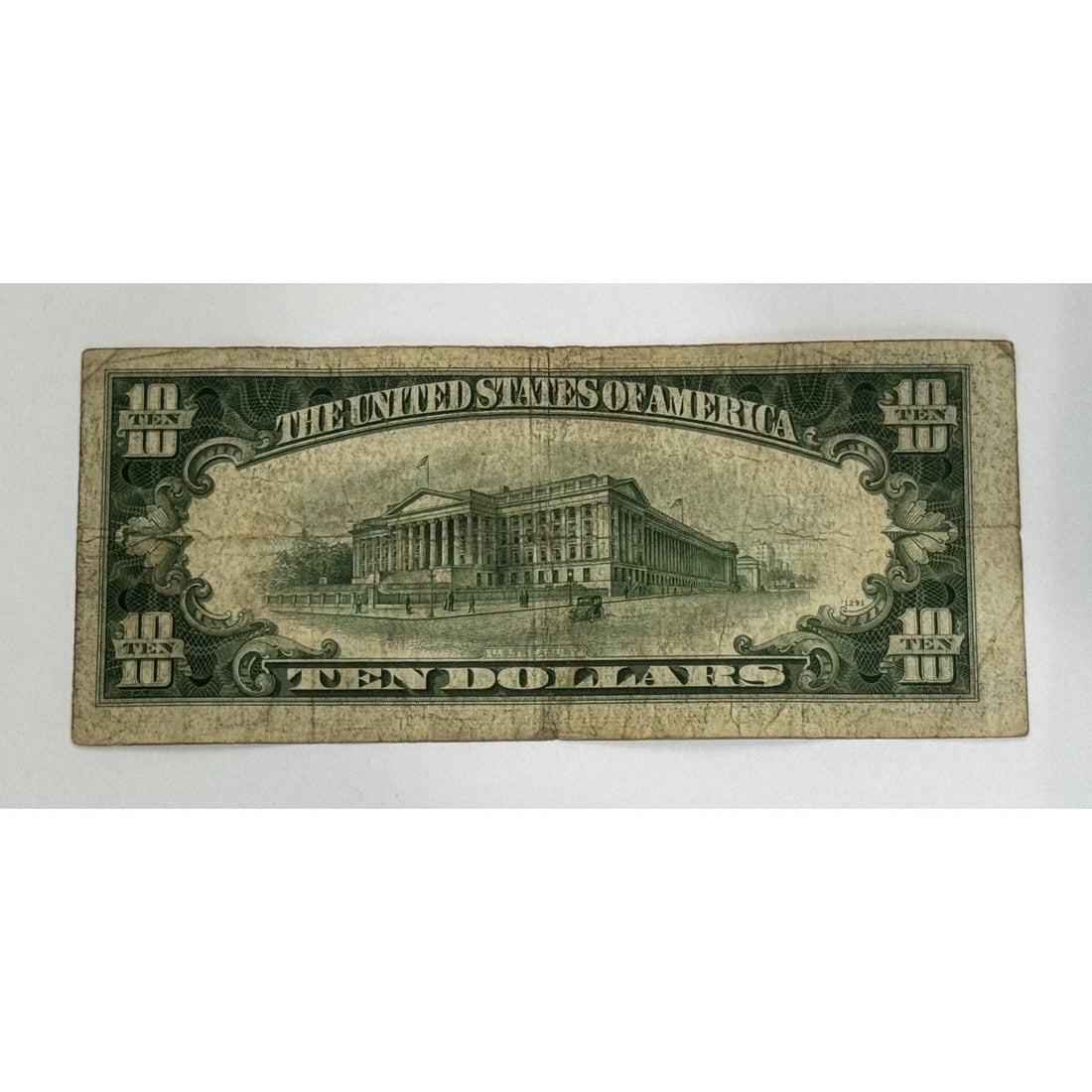 1934-D $10 Silver Certificate featuring Alexander Hamilton and blue Treasury seal vintage U.S. currency note