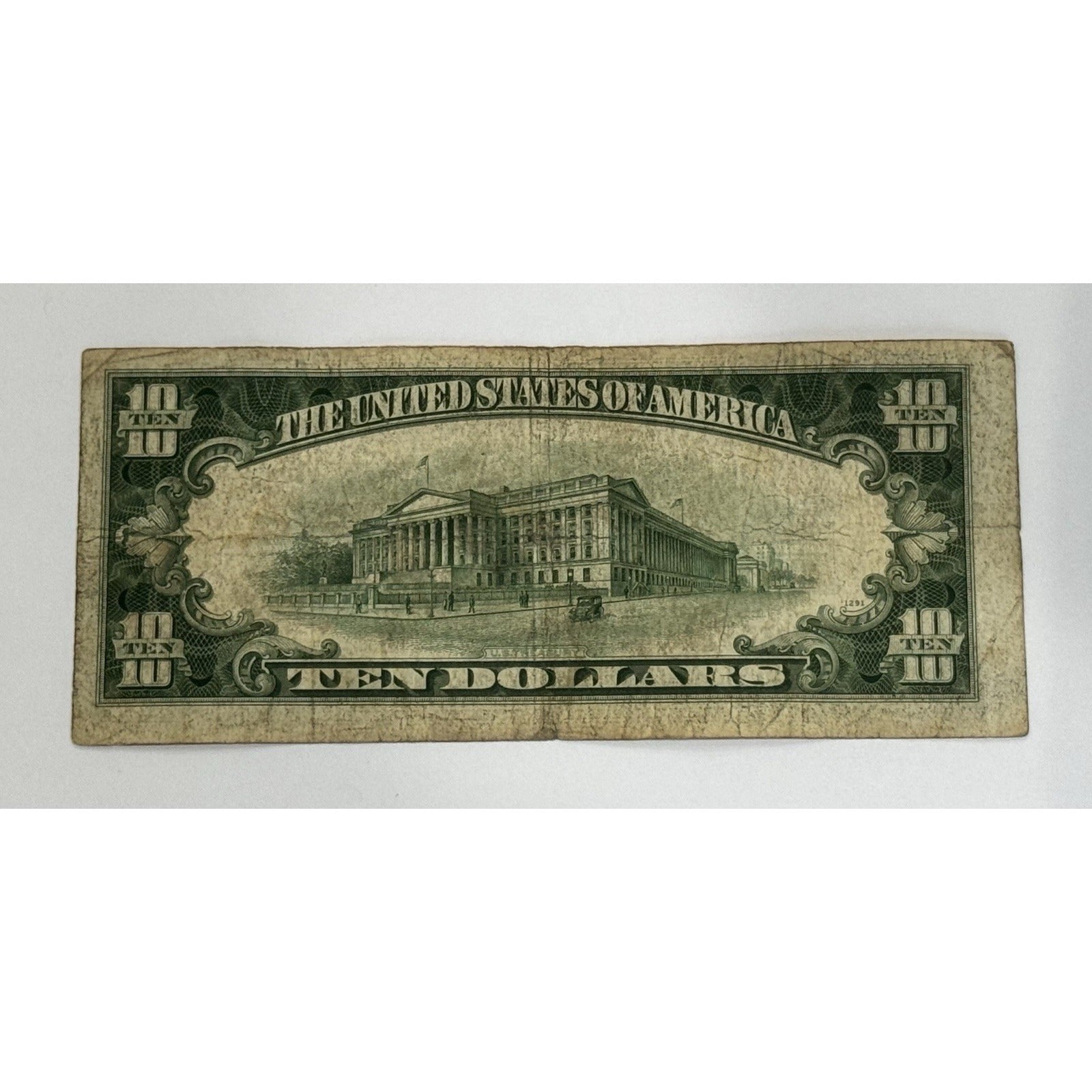 1934-D $10 Silver Certificate featuring Alexander Hamilton and blue Treasury seal vintage U.S. currency note
