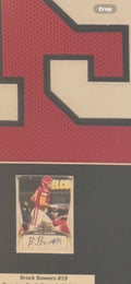 Framed Brock Bowers #19 Georgia Bulldogs jersey with signed trading card and championship memorabilia