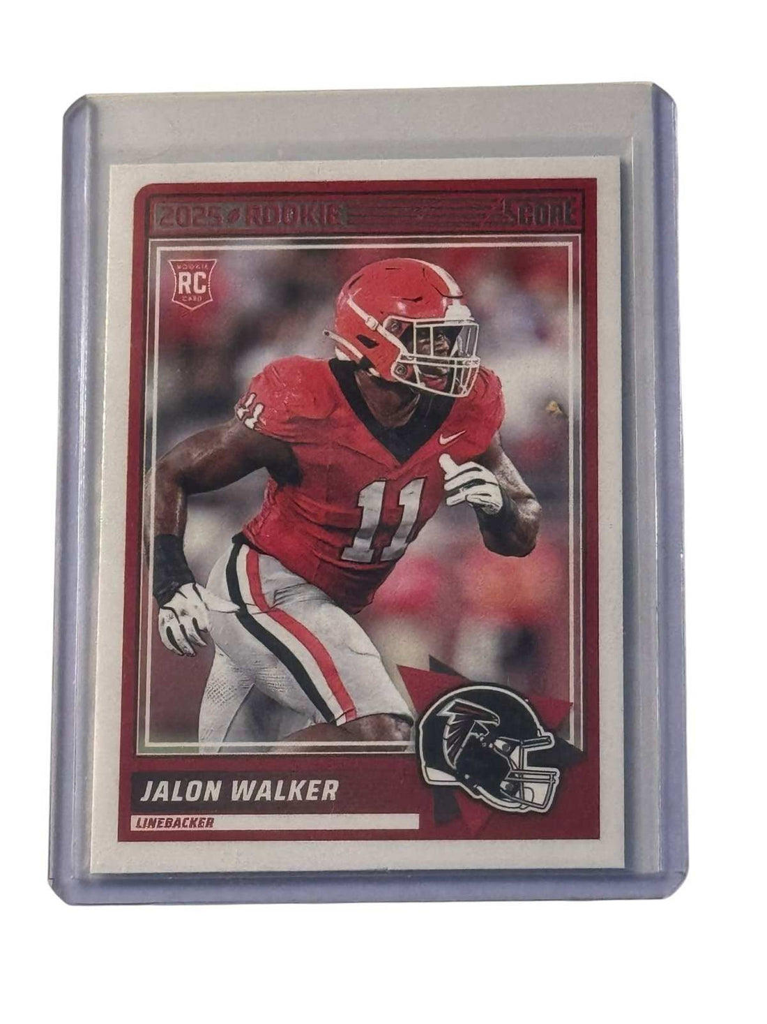 Jalon Walker 2025 Panini Score Rookie Card Atlanta Falcons linebacker in protective sleeve