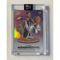 Victor Wembanyama 2023-24 Topps Now NBA rookie basketball card encased with black parallel design