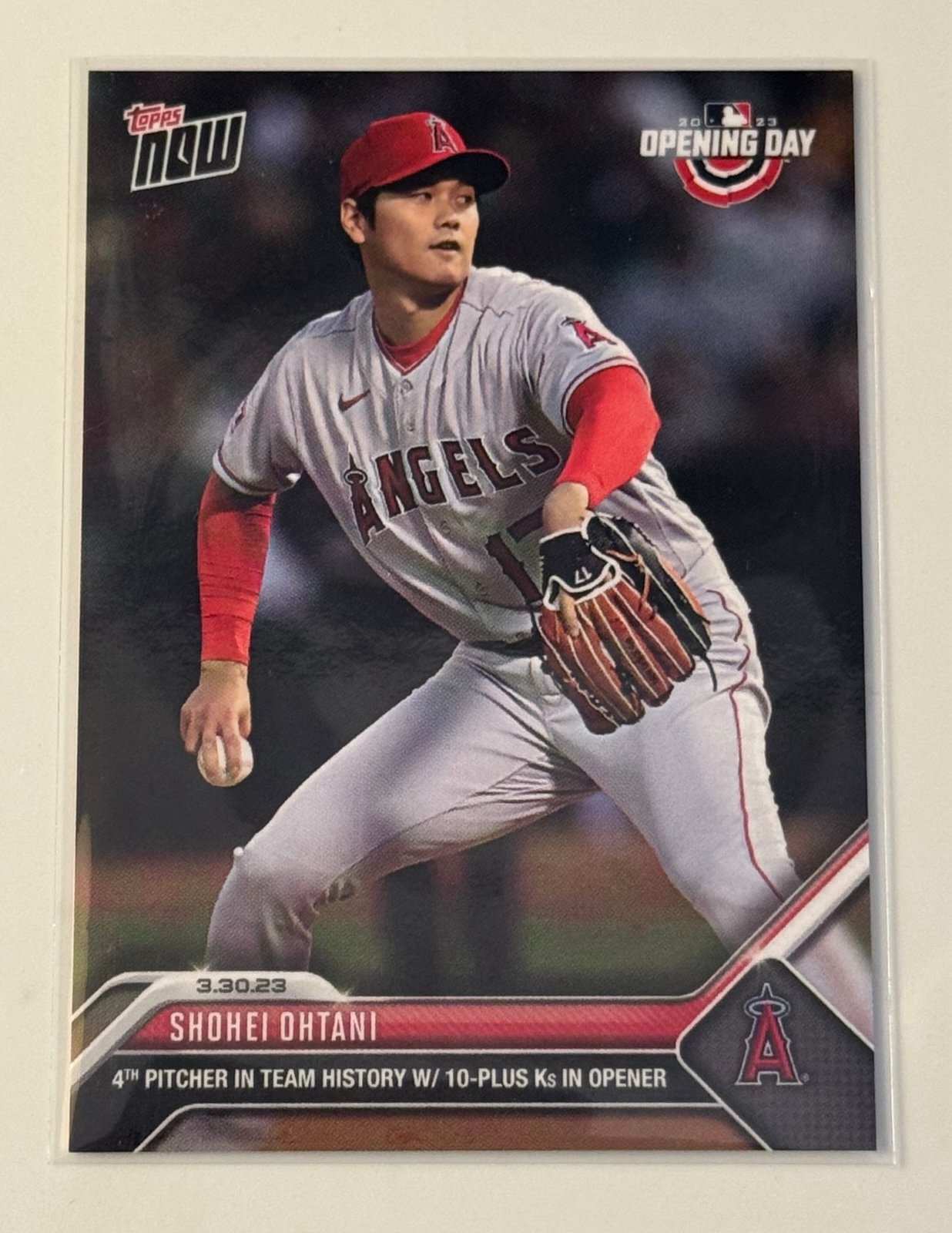 Shohei Ohtani 2023 Topps Now Opening Day MLB Angels baseball card showing pitching moment with 10+ strikeouts.