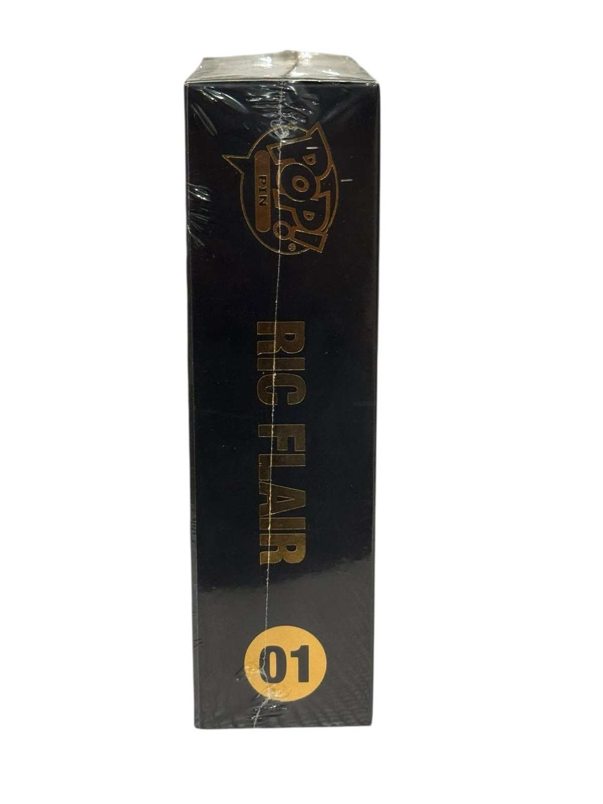 Funko Pop Pin WWE Ric Flair collectible pin box side view with black and gold design