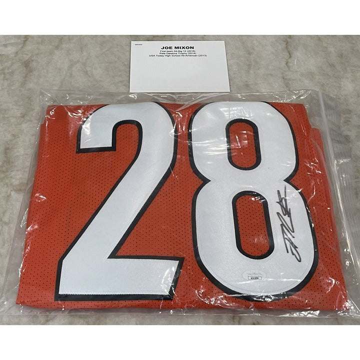Joe Mixon autographed Cincinnati Bengals football jersey with JSA certificate in packaging