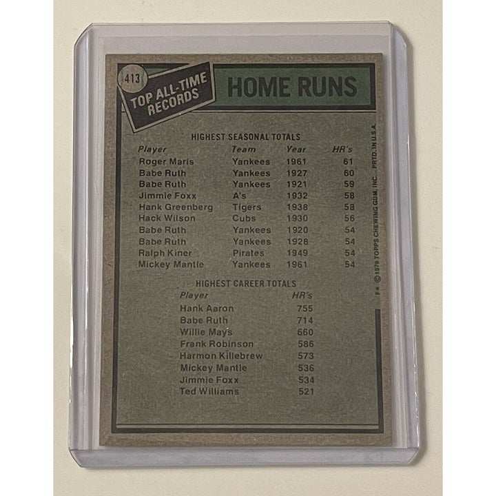 1979 Topps Baseball card featuring all-time home run record holders Roger Maris and Hank Aaron in protective sleeve