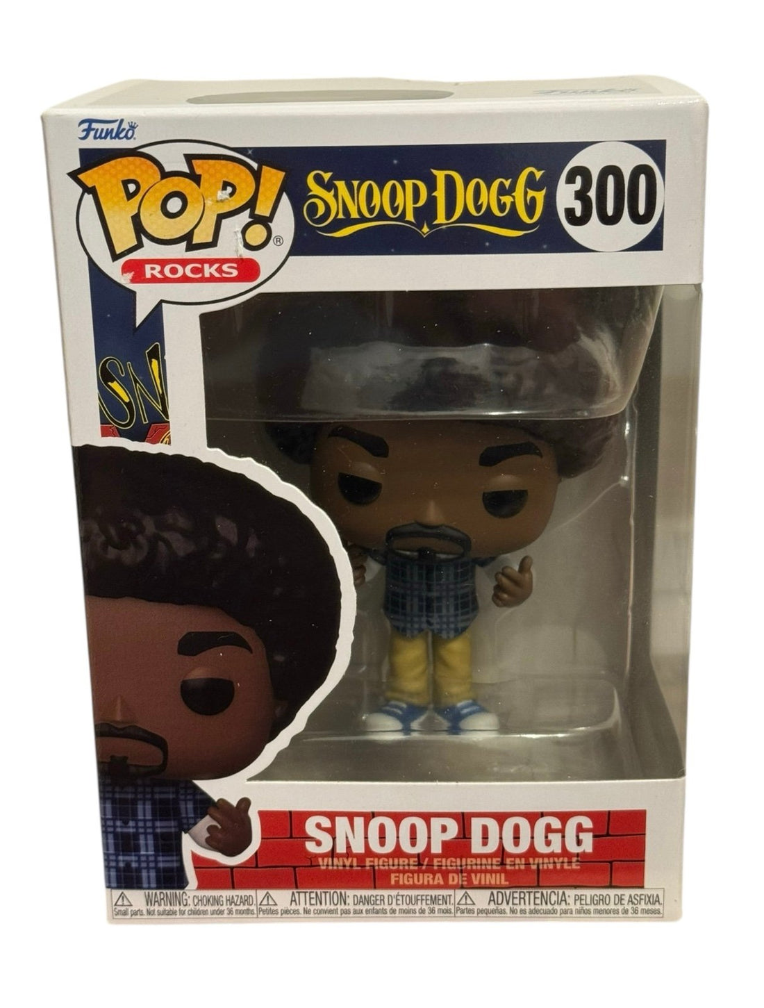 Funko Pop Rocks Snoop Dogg #300 vinyl figure in collectible box with West Coast style design