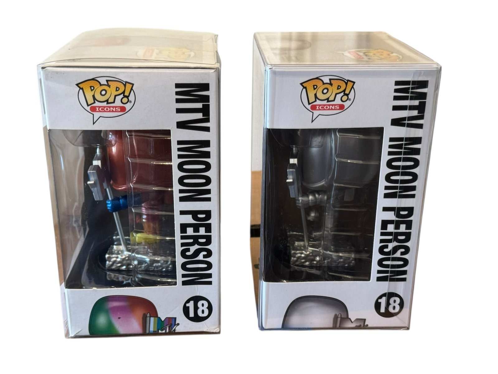 Funko Pop Icons MTV Moon Person #18 Classic and Rainbow Variant collectible figures in display boxes