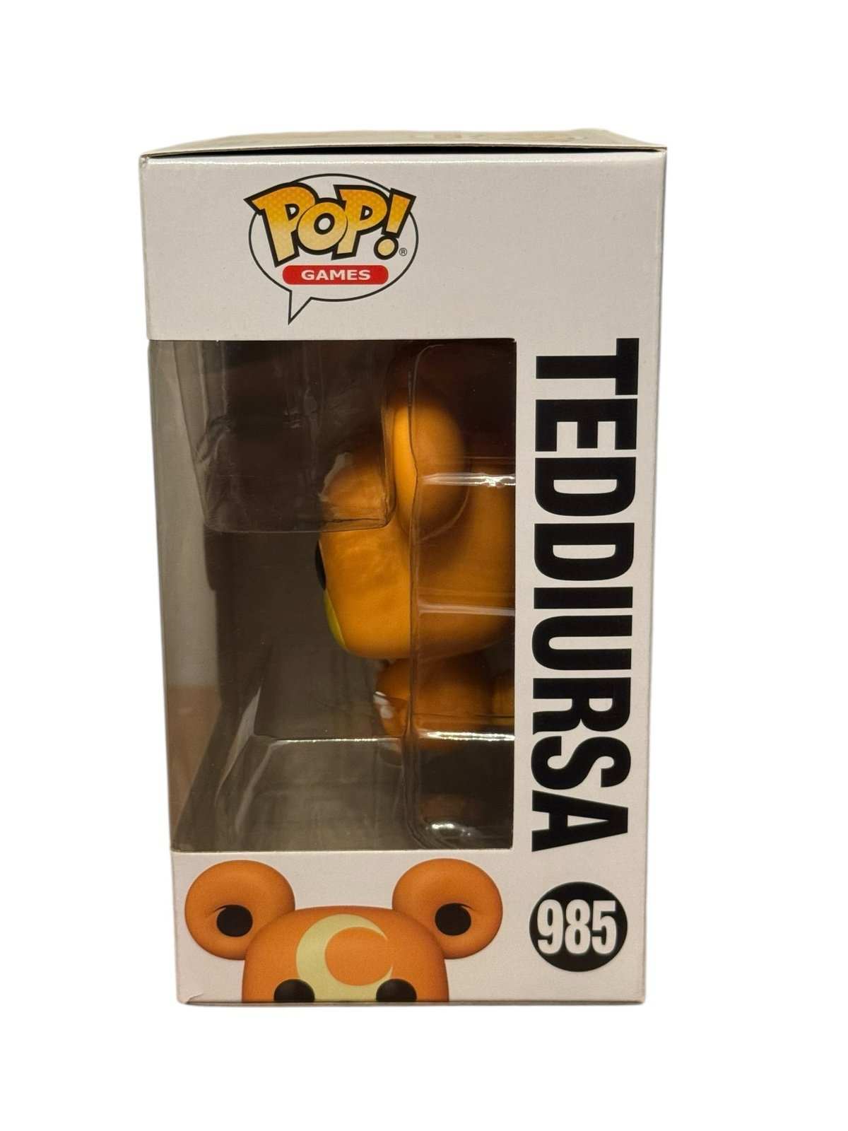Teddiursa Funko Pop vinyl figure in original box with crescent moon design and bright orange color from Pokémon series