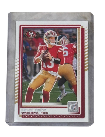 Brock Purdy 2024 Donruss San Francisco 49ers NFL quarterback football card in protective holder