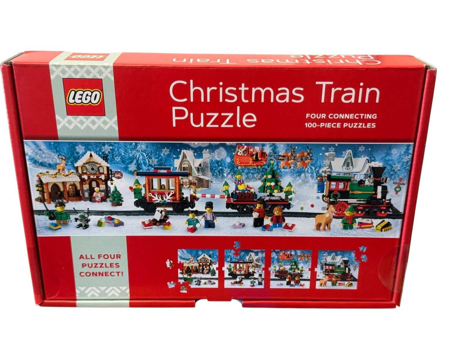 Sealed LEGO Christmas Train Puzzle 4 pack with four connecting 100-piece holiday puzzles in festive train scene box