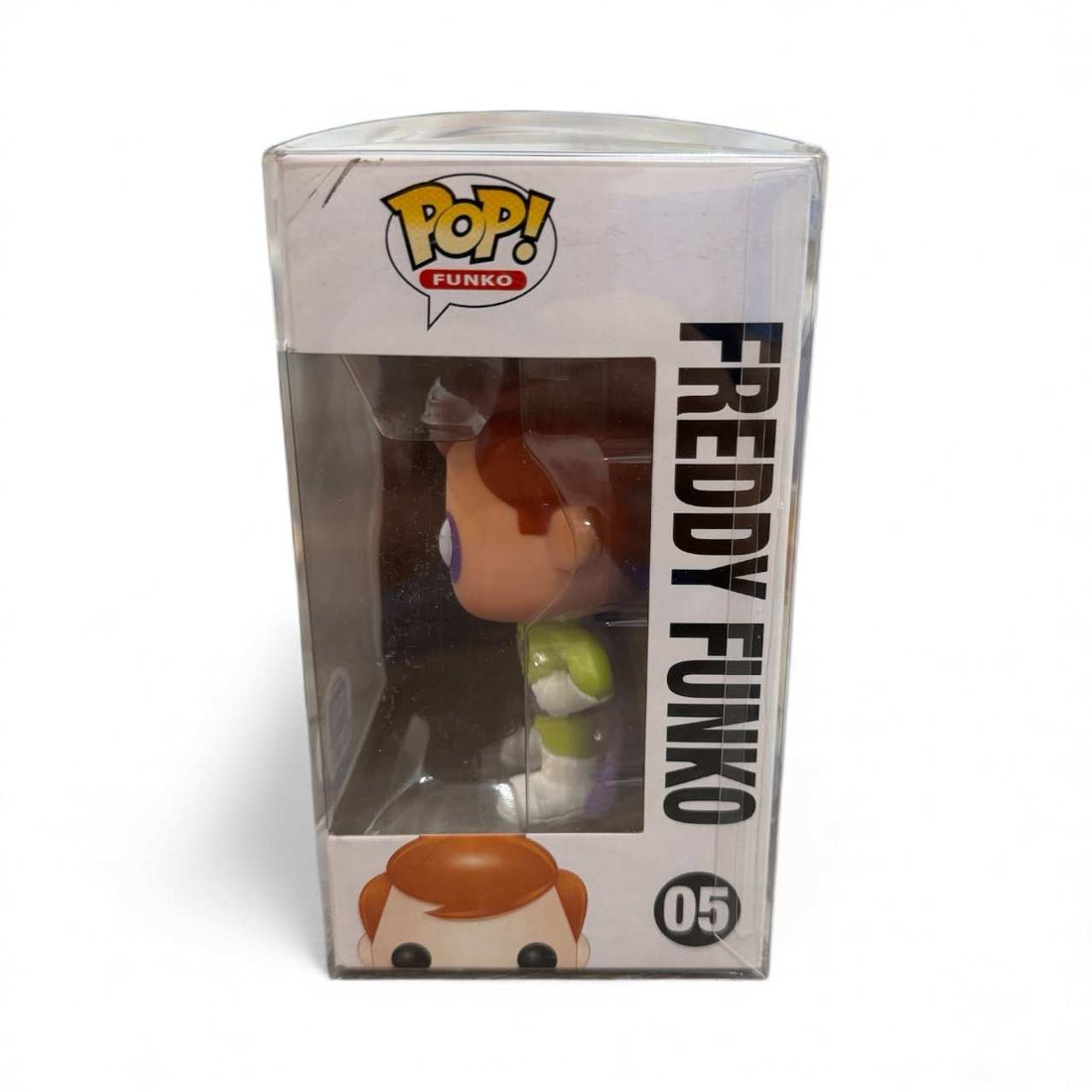 Freddy Funko #05 Funko-Shop Exclusive vinyl figure in sealed display case with superhero costume.