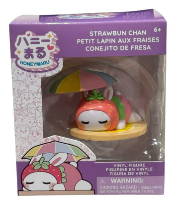 Honeymaru Strawbun Chan strawberry bunny vinyl figure in sleepy pose with umbrella in purple box