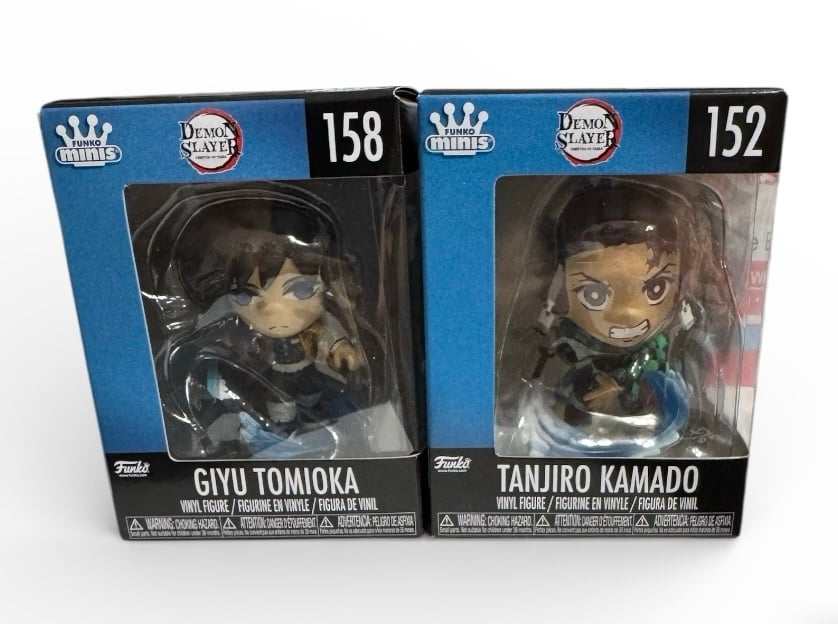 Funko Stunning MINIs Demon Slayer anime figures Giyu Tomioka 158 and Tanjiro Kamado 152 in collectible display boxes