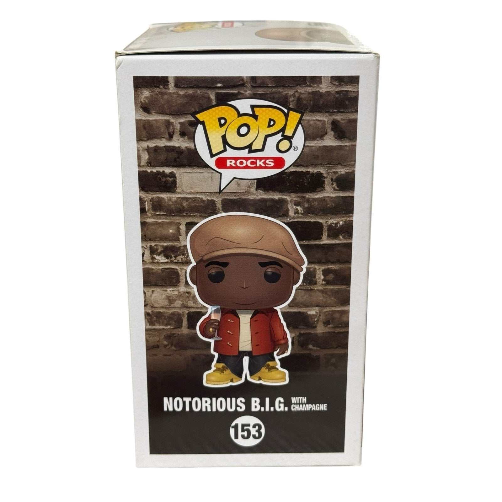 Funko Pop Notorious BIG 153 collectible figure with champagne Hot Topic exclusive Pop Rocks box display