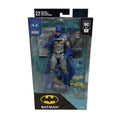 McFarlane DC Rebirth Batman 7-inch action figure in sealed packaging with accessories and digital code